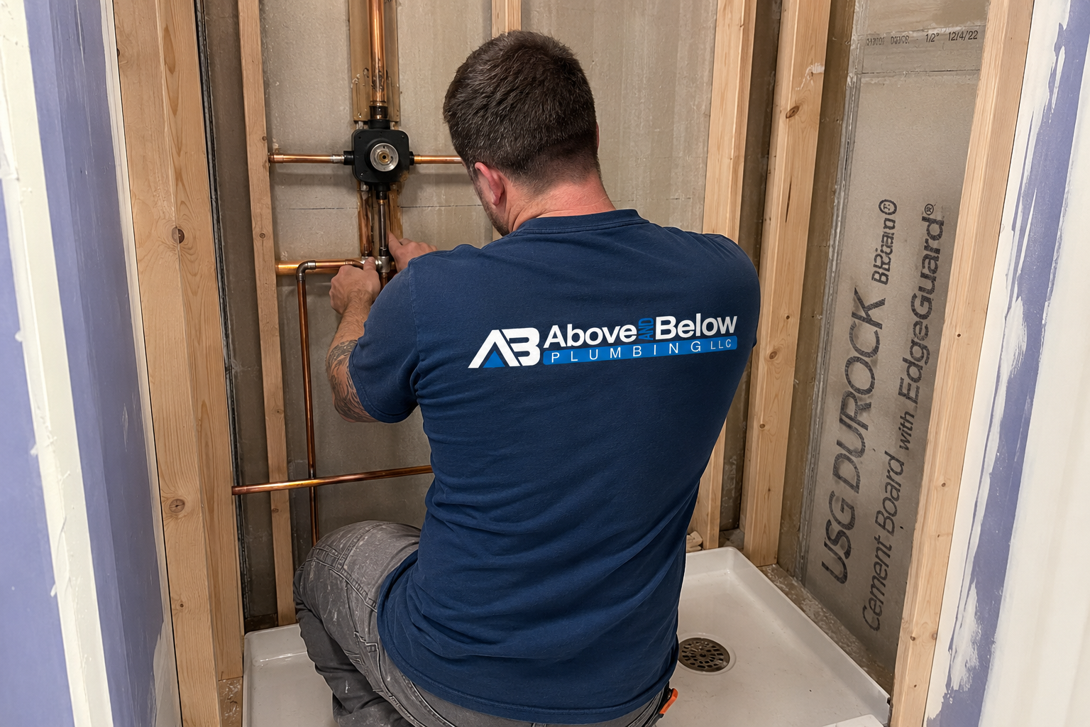 Above & Below plumbing team servicing a water heater
